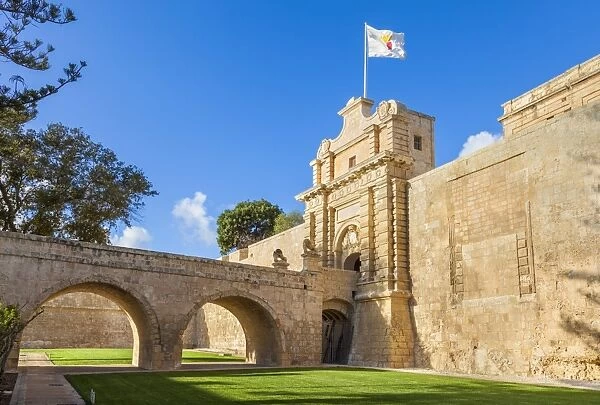 The Main gate with moat, garden and ramparts, Mdina, a Medieval walled city, Mdina, Malta, Europe