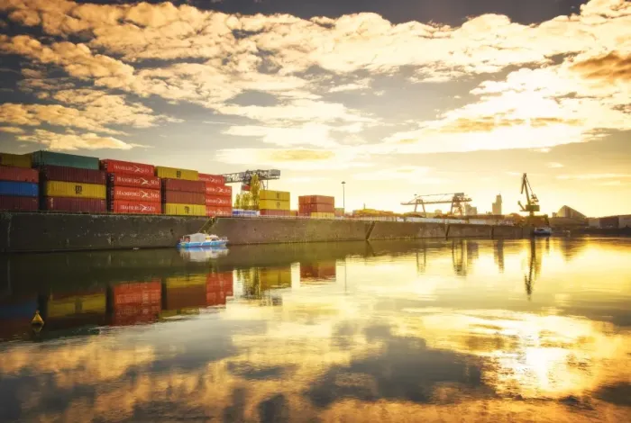 Framed Print : One of Main Rivers side channels with stacked containers and golden reflections Framed Print : One of Main Rivers side channels with stacked containers and golden reflections