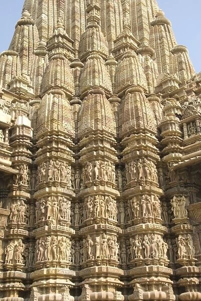Detail of the main spire with some of the 646 erotic figures carved in sandstone on the Kandariya Mahadeva Temple, largest of the Chandela temples, within Western Group, Khajuraho, UNESCO World Heritage Site, Madhya Pradesh state