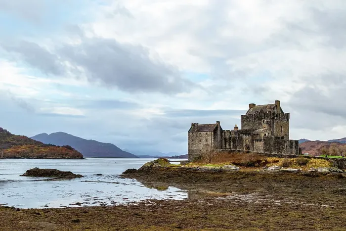 Framed Print : Majestic ancient castle by a serene lake with cloudy skies and mountainous backdrop, Eilean Donan, Dornie, Scotland, United Kingdom, Europe Framed Print : Majestic ancient castle by a serene lake with cloudy skies and mountainous backdrop, Eilean Donan, Dornie, Scotland, United Kingdom, Europe