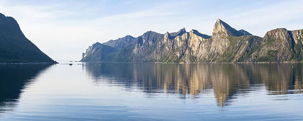 Majestic mountains Segla and Hesten along the unspoiled waters of Mefjord, Senja