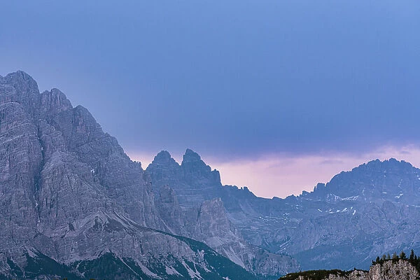 Majestic rocks of Three Peaks of Lavaredo during a pink sunrise, Dolomites, South Tyrol, Italy, Europe