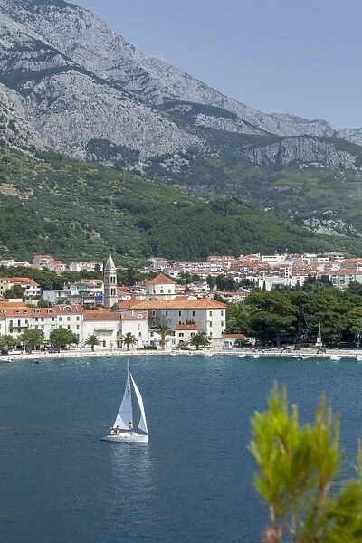 Makarska harbour with yacht and mountains behind, Dalmatian Coast, Croatia, Europe