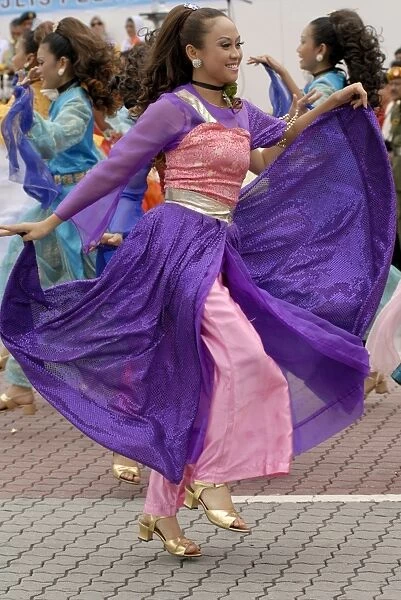Malay female dancer wearing traditional dress at celebrations