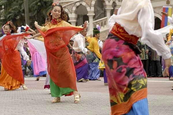 Malay female dancers wearing traditional dress at celebrations