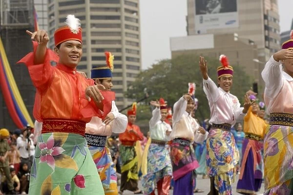 Malay male dancer wearing traditional dress at celebrations