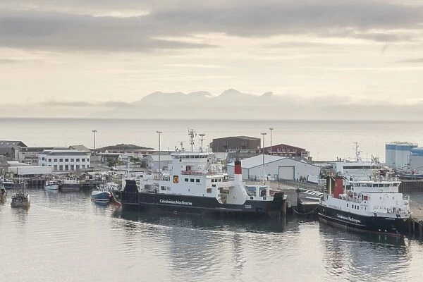 Mallaig harbour and distant Isle of Rum, Highlands, Scotland, United Kingdom, Europe
