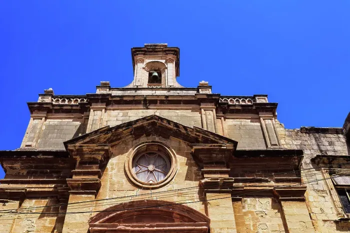 Framed Print : Malta Oratory of The Holy Cross exterior with limestone, Maltese cross and bell tower under a bright blue sky, old city of Birgu (Citta Vittoriosa), Malta, Mediterranean, Europe Framed Print : Malta Oratory of The Holy Cross exterior with limestone, Maltese cross and bell tower under a bright blue sky, old city of Birgu (Citta Vittoriosa), Malta, Mediterranean, Europe