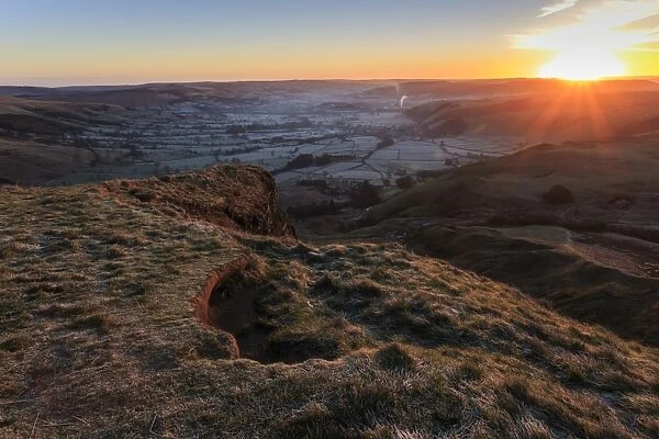 Mam Tor (Shivering Mountain), exposed east face strata lit by rising sun in winter, Castleton, Peak District, Derbyshire, England, United Kingdom, Europe