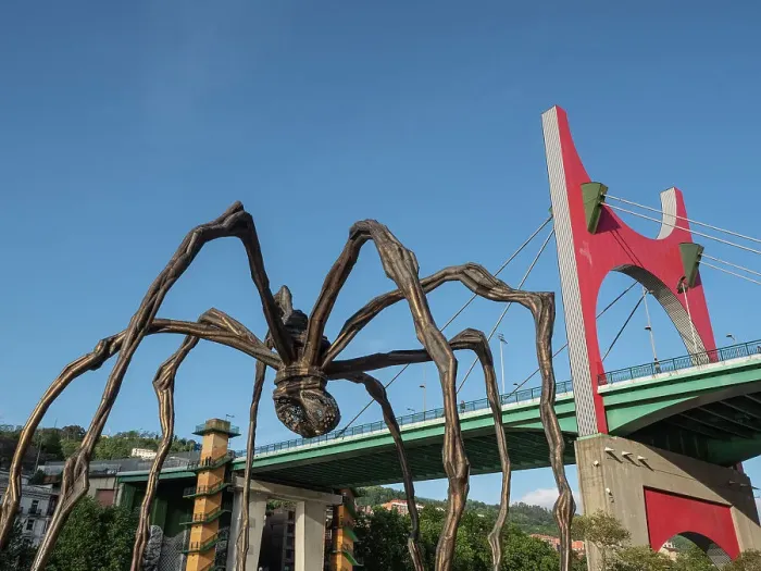 Framed Print : Maman, a sculpture of a spider by Louise Bourgeois, next to Red Arches on the La Salve Bridge, Bilbao, Basque Country, Spain, Europe Framed Print : Maman, a sculpture of a spider by Louise Bourgeois, next to Red Arches on the La Salve Bridge, Bilbao, Basque Country, Spain, Europe