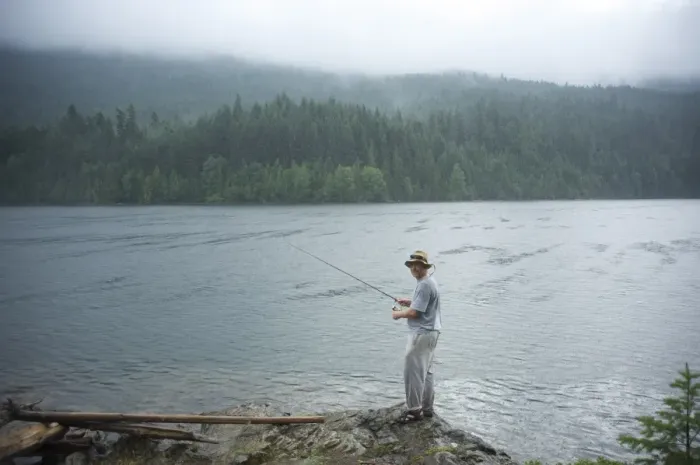 Framed Print : Man, 30 years old, fishes on Ross Lake, North Cascades National Park, Washington Framed Print : Man, 30 years old, fishes on Ross Lake, North Cascades National Park, Washington