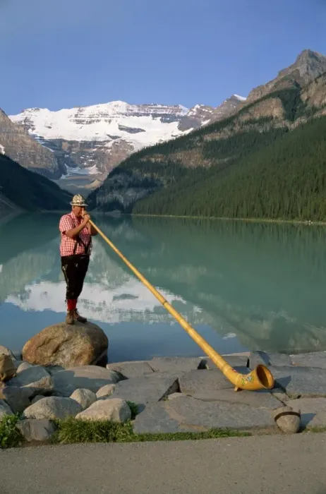 Framed Print : Man with an alpenhorn beside Lake Louise in the Banff National Park, Alberta Framed Print : Man with an alpenhorn beside Lake Louise in the Banff National Park, Alberta