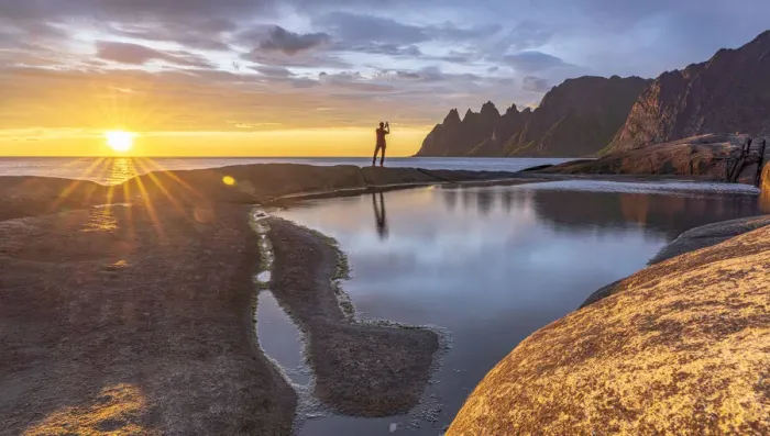 Framed Print : Man in the backlight sunset photographing the mountain peaks with smartphone, Tungeneset Framed Print : Man in the backlight sunset photographing the mountain peaks with smartphone, Tungeneset