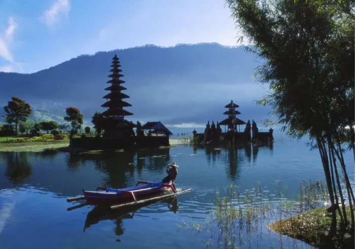 Framed Print : Man in Boat Rowing and Hindu Temples at Lake Bratan, Pura Ulu Danau, Bali Framed Print : Man in Boat Rowing and Hindu Temples at Lake Bratan, Pura Ulu Danau, Bali