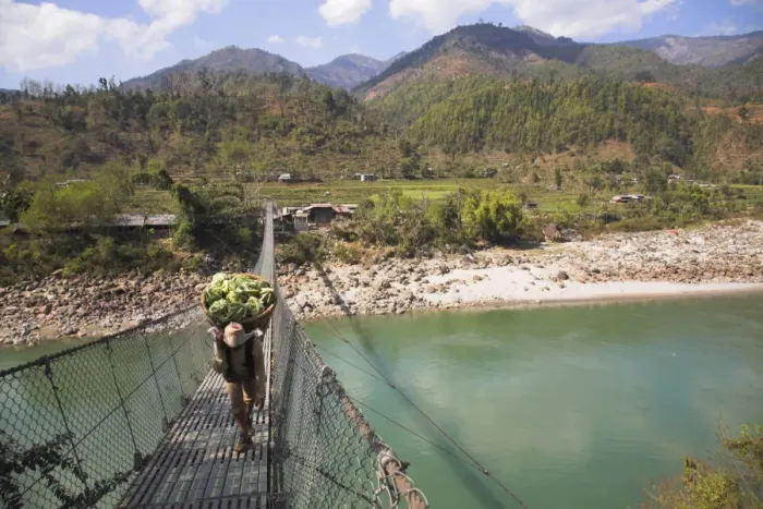 Framed Print : Man carrying vegetables across a rope bridge, Trisuli Center, Bandare Village Framed Print : Man carrying vegetables across a rope bridge, Trisuli Center, Bandare Village