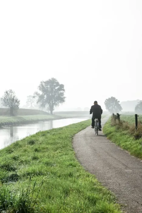 Framed Print : Man cycling on countryside cycle path next to the River Mark in autumn, Breda, North Brabant, The Netherlands (Holland), Europe Framed Print : Man cycling on countryside cycle path next to the River Mark in autumn, Breda, North Brabant, The Netherlands (Holland), Europe