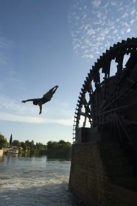 Framed Print : Man diving off water wheel Framed Print : Man diving off water wheel