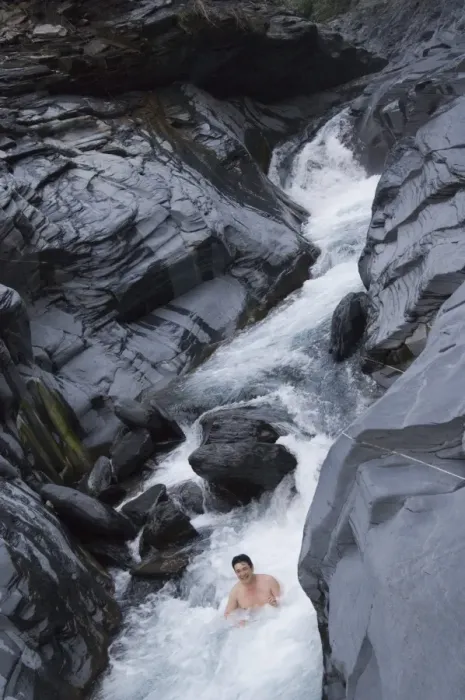 Framed Print : Man enjoying natural hot river water of Tona hotspring bath resort Framed Print : Man enjoying natural hot river water of Tona hotspring bath resort