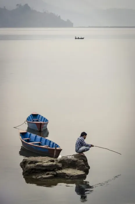 Framed Print : A man fishing on Phewa Tal (Phewa Lake), Pokhara, Nepal, Asia Framed Print : A man fishing on Phewa Tal (Phewa Lake), Pokhara, Nepal, Asia