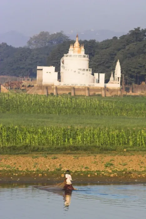 Framed Print : Man fishing on Taugthaman Lake near Spiral temple and U Beins Bridge Framed Print : Man fishing on Taugthaman Lake near Spiral temple and U Beins Bridge