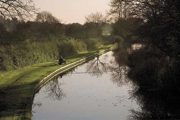 Man fishing from the towpath, Worcester and Birmingham canal, Hanbury, Worcestershire