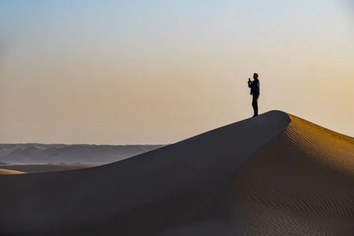 Framed Print : Man hiking through the sand dunes, Dirkou, Djado Plateau, Sahara, Niger, Africa Framed Print : Man hiking through the sand dunes, Dirkou, Djado Plateau, Sahara, Niger, Africa