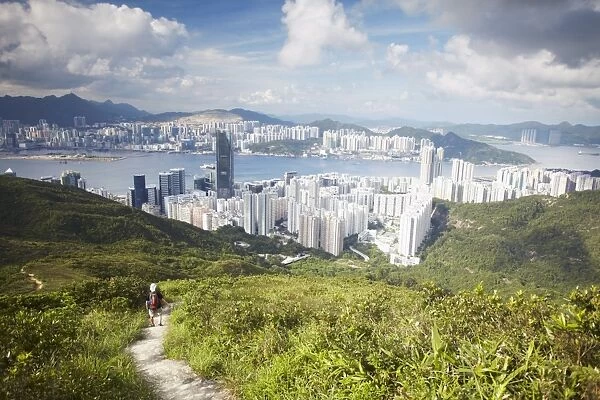 Man hiking on trail through hills behind Quarry Bay, Hong Kong, China, Asia