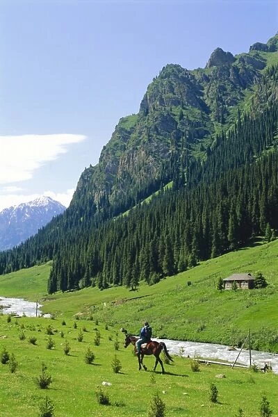 Man on horse at Altyn-Arashan near Kara-Kol