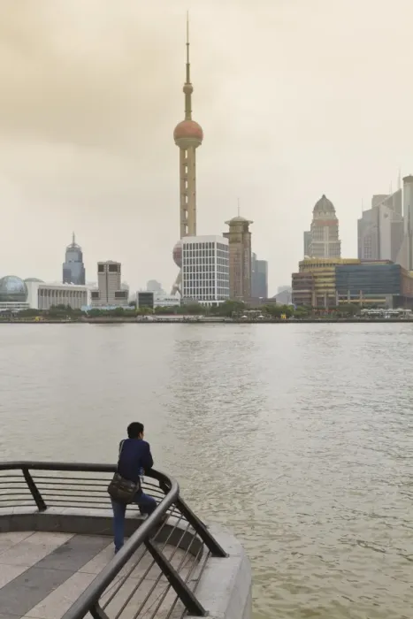 Framed Print : A man looking at the Oriental Pearl Tower and Pudong skyline across the Huangpu River from the Bund, Shanghai, China, Asia Framed Print : A man looking at the Oriental Pearl Tower and Pudong skyline across the Huangpu River from the Bund, Shanghai, China, Asia
