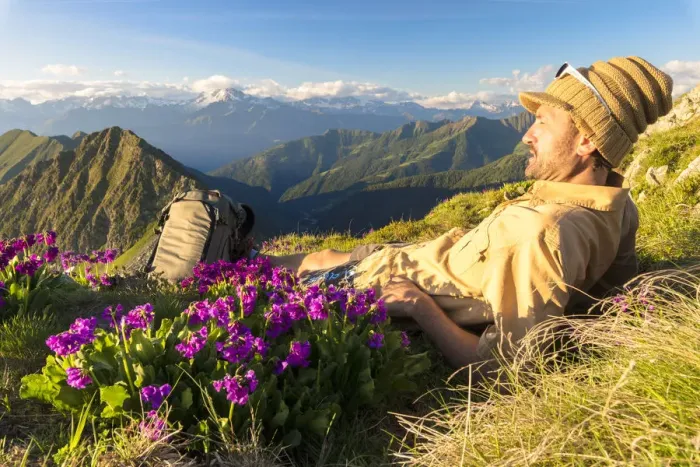 Framed Print : Man lying down on top of Monte Azzarini looks to Monte Disgrazia and Monte Pedena Framed Print : Man lying down on top of Monte Azzarini looks to Monte Disgrazia and Monte Pedena