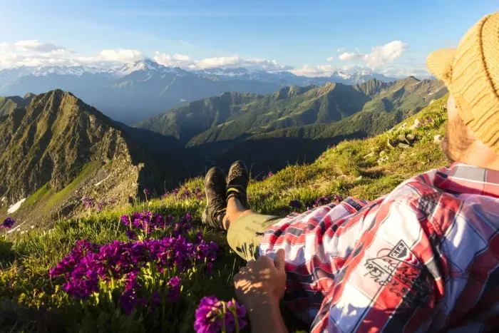 Framed Print : Man lying down on top of Monte Azzarini looks to Monte Disgrazia and Monte Pedena Framed Print : Man lying down on top of Monte Azzarini looks to Monte Disgrazia and Monte Pedena