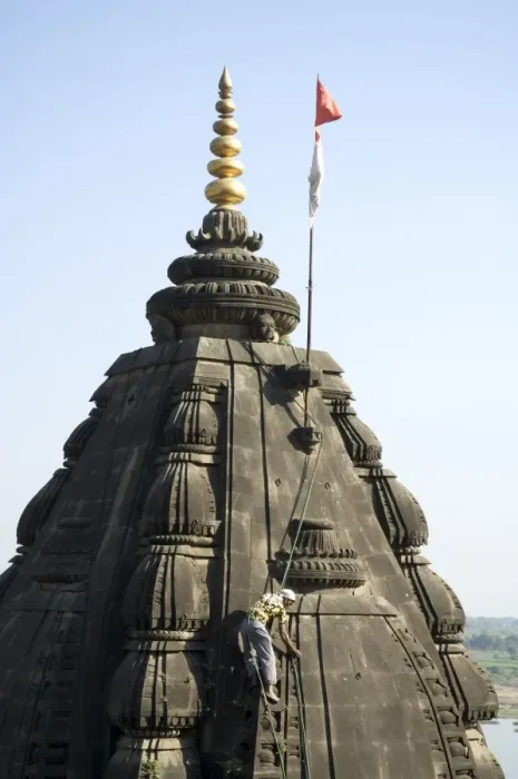 Framed Print : Man picking weeds out of the Shiva Hindu temple on Framed Print : Man picking weeds out of the Shiva Hindu temple on