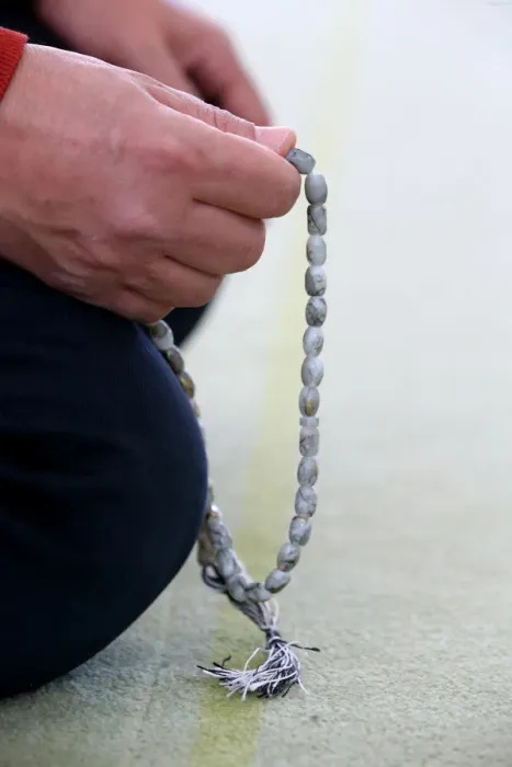 Framed Print : Man praying in a mosque with Tasbih (prayer beads), Bussy-Sainte-Georges, Seine-et-Marne Framed Print : Man praying in a mosque with Tasbih (prayer beads), Bussy-Sainte-Georges, Seine-et-Marne