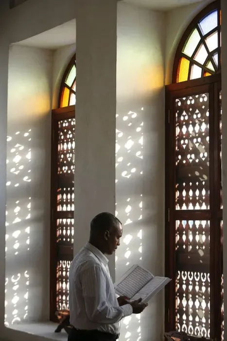 Framed Print : Man reading Koran in a Doha mosque, Doha, Qatar, Middle East Framed Print : Man reading Koran in a Doha mosque, Doha, Qatar, Middle East