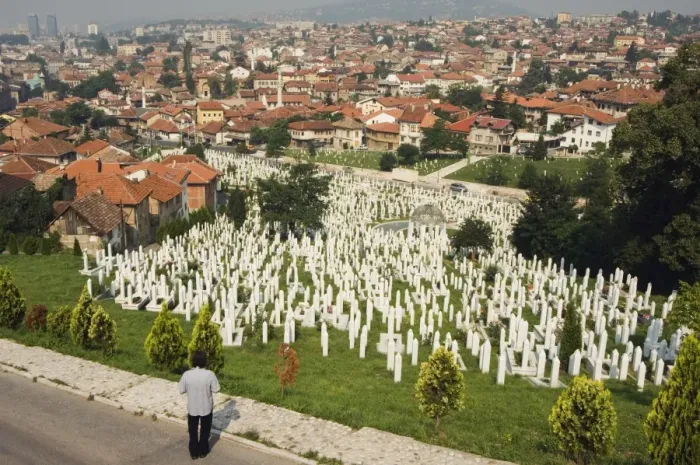 Framed Print : Man reflecting at cemetery overlooking city houses, Sarajevo, Bosnia, Bosnia-Herzegovina Framed Print : Man reflecting at cemetery overlooking city houses, Sarajevo, Bosnia, Bosnia-Herzegovina