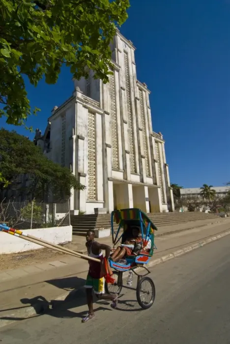 Framed Print : Man with a rickshaw in front of a modern church in Mahajanga, Madagascar, Africa Framed Print : Man with a rickshaw in front of a modern church in Mahajanga, Madagascar, Africa