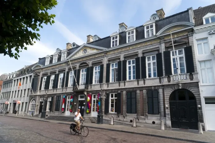 Framed Print : Man riding in front of the Theater Aan Het Vrijthof, Vrijthof Square, Mstricht