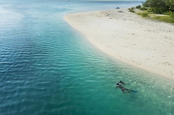 Man snorkeling in the beautiful lagoon of Ouvea, Loyalty Islands, New Caledonia, Pacific