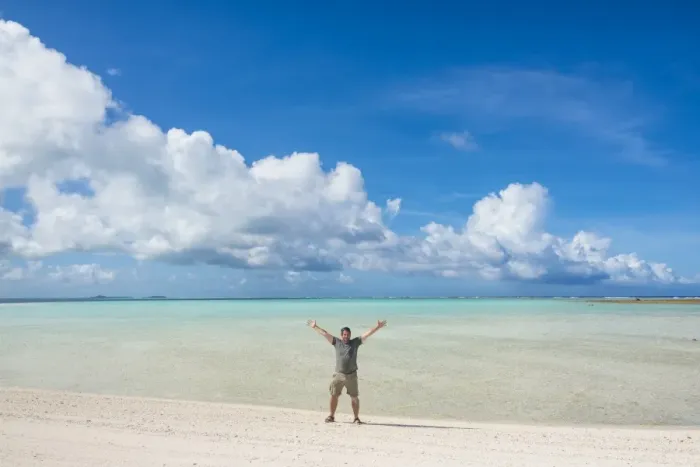 Framed Print : Man standing on a white sand beach in the lagoon of Wallis, Wallis and Futuna, Pacific Framed Print : Man standing on a white sand beach in the lagoon of Wallis, Wallis and Futuna, Pacific