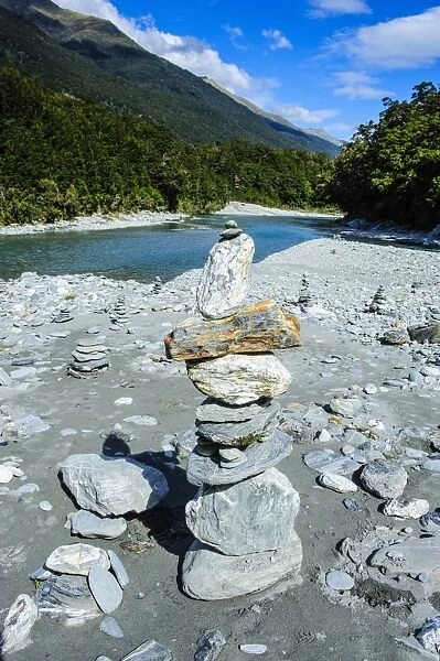 Man made stone pyramids at the Blue Pools, Hst Pass, South Island, New Zealand, Pacific