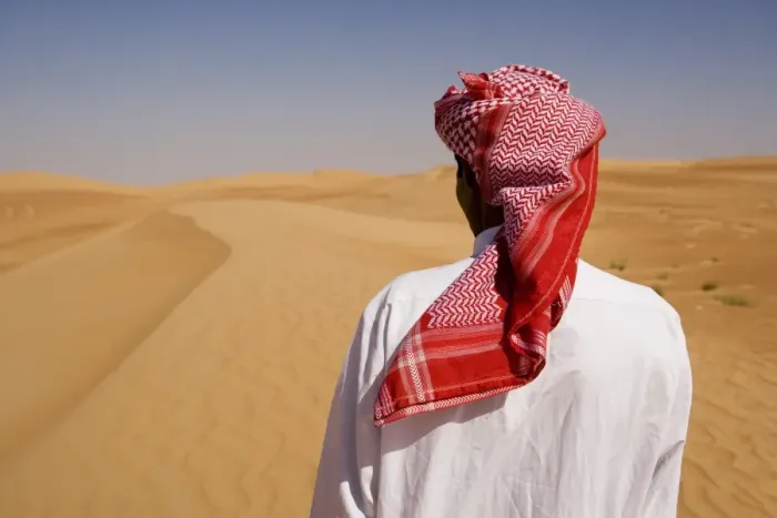 Framed Print : Man in traditional dress in the desert outside Dubai Framed Print : Man in traditional dress in the desert outside Dubai