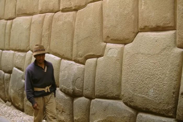 Framed Print : Man walking alongside Inca wall Framed Print : Man walking alongside Inca wall