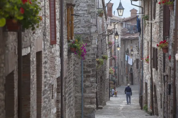 Framed Print : Man walking along Via Aquilante, Gubbio, Umbria, Italy, Europe Framed Print : Man walking along Via Aquilante, Gubbio, Umbria, Italy, Europe