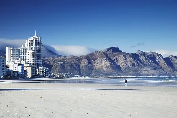 Man walking on beach, Strand, Western Cape, South Africa, Africa