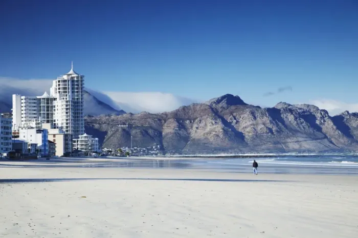 Framed Print : Man walking on beach, Strand, Western Cape, South Africa, Africa Framed Print : Man walking on beach, Strand, Western Cape, South Africa, Africa