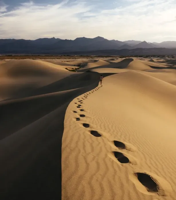 Framed Print : Man walking through Mesquite Sand Dunes at dawn, Death Valley National Park, California Framed Print : Man walking through Mesquite Sand Dunes at dawn, Death Valley National Park, California
