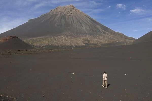 Man walking towards volcano on Fogo, Cape Verde Islands, Africa