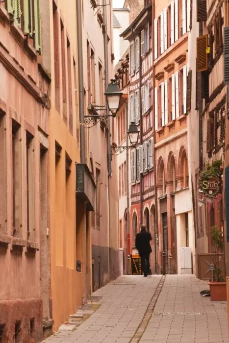 Framed Print : A man walks through La Petite France, Grande Ile, UNESCO World Heritage Site, Strasbourg, Bas-Rhin, Alsace, France, Europe Framed Print : A man walks through La Petite France, Grande Ile, UNESCO World Heritage Site, Strasbourg, Bas-Rhin, Alsace, France, Europe