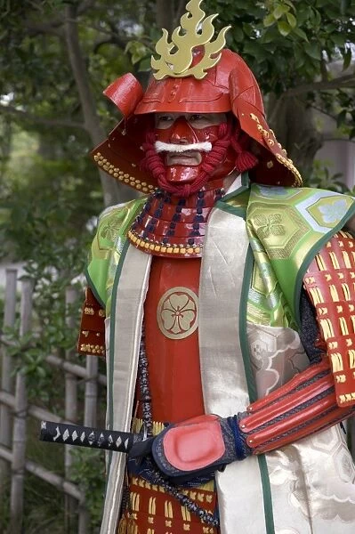 Man wearing warrior costume posing for photos during a festival in Odawara, Japan, Asia