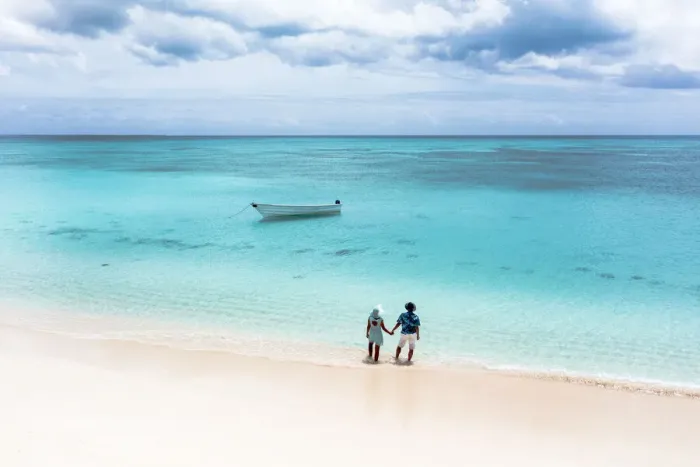 Framed Print : Man and woman holding hands on a tropical beach admiring the crystal clear sea, aerial view, Antigua and Barbuda, West Indies, Caribbean, Central America Framed Print : Man and woman holding hands on a tropical beach admiring the crystal clear sea, aerial view, Antigua and Barbuda, West Indies, Caribbean, Central America